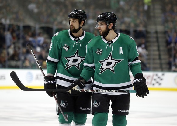 FILE - In this Friday, Dec. 29, 2017 file photo, Dallas Stars left wing Jamie Benn (14) and center Tyler Seguin (91) look over the St. Louis Blues defense during the first period of an NHL hockey game ...