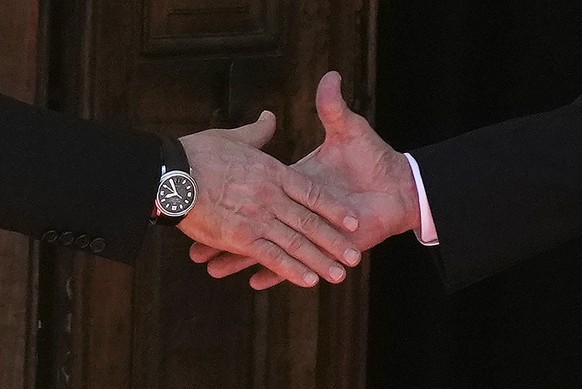 Russian President Vladimir Putin, left, and U.S President Joe Biden shake hands during their meeting at the &#039;Villa la Grange&#039; in Geneva, Switzerland in Geneva, Switzerland, Wednesday, June 1 ...