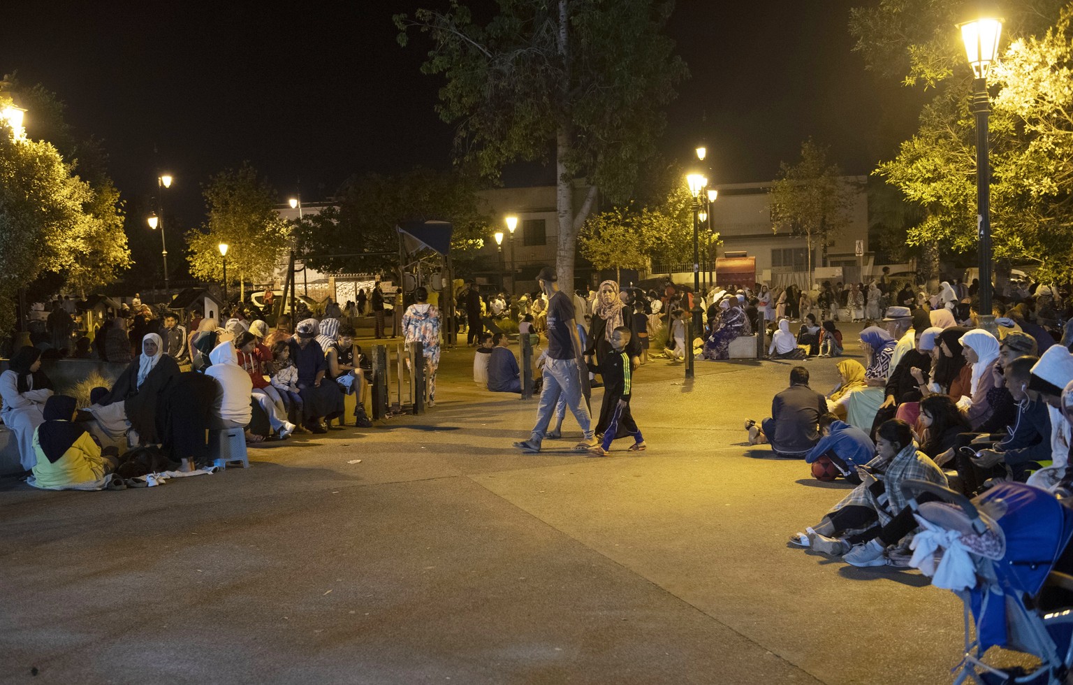 epa10849890 People seek safety outside after an earthquake in Rabat, Morocco, September 8, 2023. A magnitude 6.8 earthquake struck Morocco late September 8, damaging buildings in major cities and...
