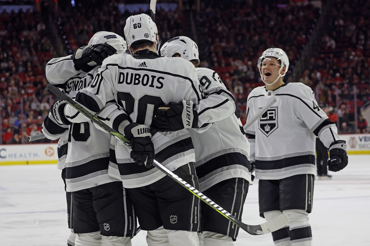 Los Angeles Kings celebrate after a goal by Pierre-Luc Dubois (80) during the third period of an NHL hockey game against the Carolina Hurricanes in Raleigh, N.C., Monday, Jan. 15, 2024. (AP Photo/Karl ...