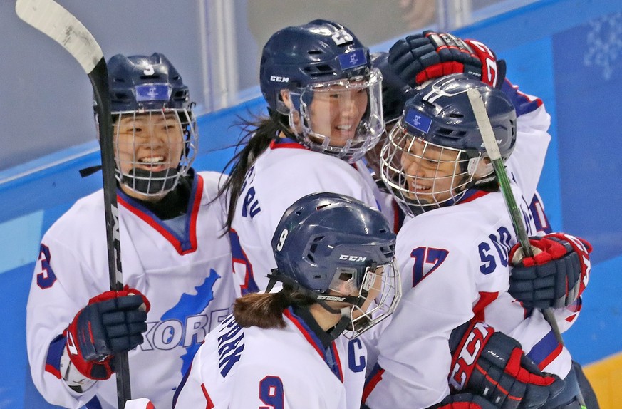 epa06545041 Unified inter-Korean players celebrate after scoring during the women&#039;s Ice Hockey Classifications match between Sweden and Korea at the Kwandong Hockey Centre during the PyeongChang  ...