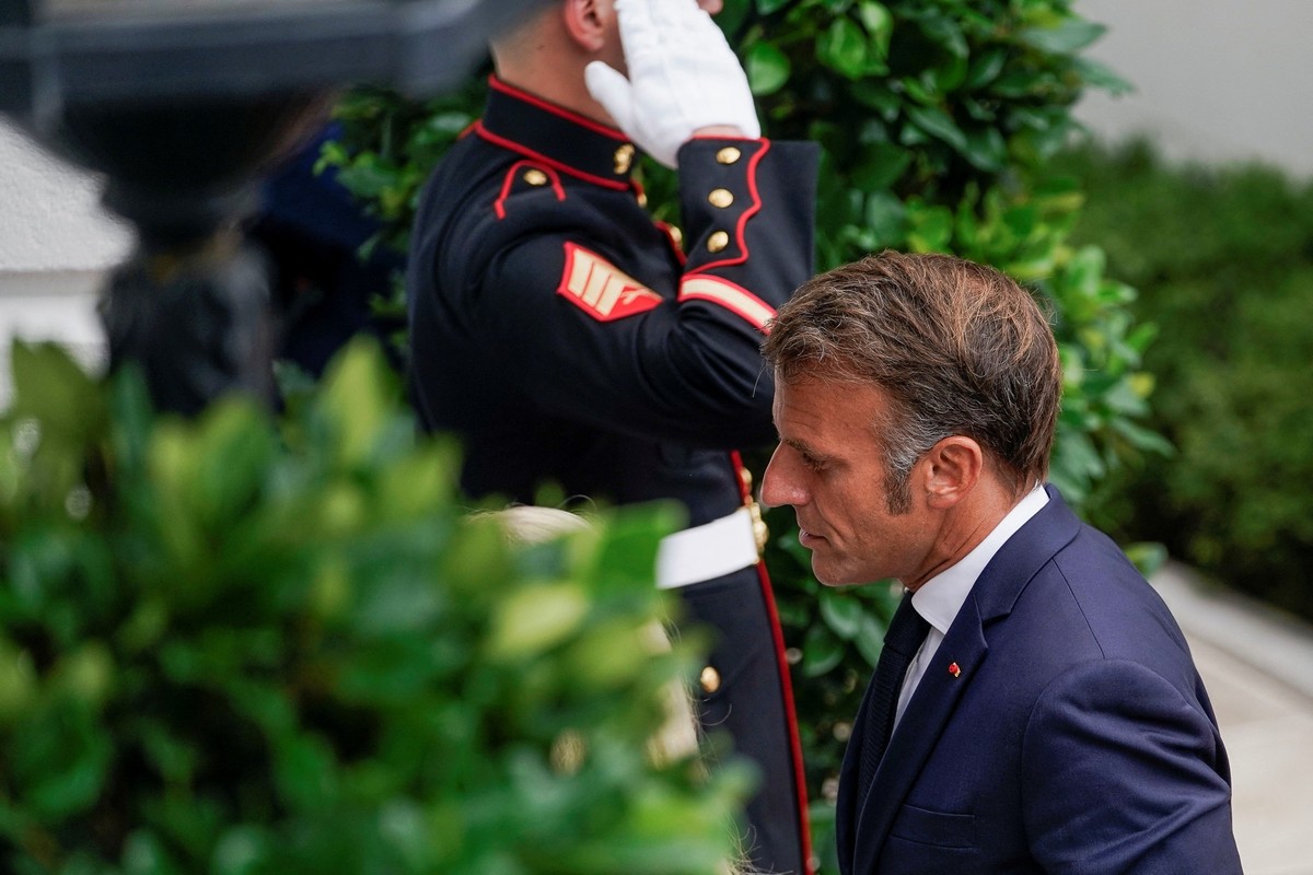 U.S. Chief of Protocol Monica Crowley walks with French President Emmanuel Macron as he arrives at the White House amid negotiations to end the Russian war in Ukraine, in Washington, D.C., U.S., Augus ...