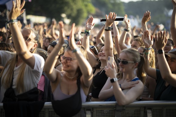epa11443714 Visitors enjoy the performance of German band Provinz at the Openair St. Gallen, in St. Gallen, Switzerland, 28 June 2024. The music festival will take place until 30 June 2024. EPA/GIAN E ...