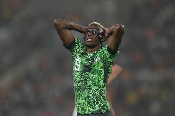 FILE - Nigeria&#039;s Victor Osimhen reacts after missing an opportunity to score during the African Cup of Nations semifinal soccer match between Nigeria and South Africa, at the Peace of Bouake stad ...