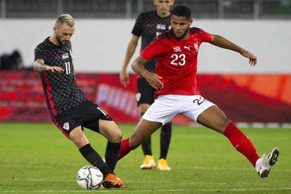 Croatia&#039;s midfielder Marcelo Brozovic, left, fights for the ball with Switzerland&#039;s midfielder Simon Sohm, right, during an international friendly test match between the the national soccer  ...