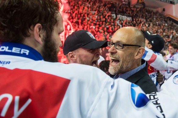 Zurich&#039;s head coach Hans Kossman celebrates the Swiss national championship, during the seventh match of the playoff final of the National League of the ice hockey Swiss Championship between the  ...