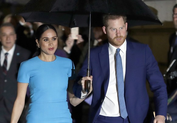 FILE - In this March 5, 2020, file photo, Britain&#039;s Prince Harry and Meghan, Duchess of Sussex, arrive at the annual Endeavour Fund Awards in London. Meghan and Prince Harry