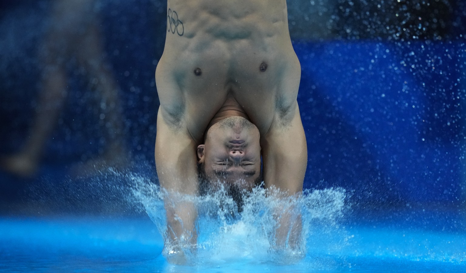 Sebastian Morales Mendoza of Colombia competes in men&#039;s diving 3m springboard preliminary at the Tokyo Aquatics Centre at the 2020 Summer Olympics, Monday, Aug. 2, 2021, in Tokyo, Japan. (AP Phot ...