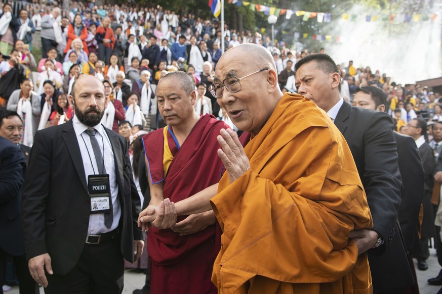 Tibetan spiritual leader, the Dalai Lama, is welcomed by Tibetans living in Switzerland upon his arrival at the Tibet Institute in Rikon, central Switzerland, Friday, Sept. 21, 2018. (Ennio Leanza/Key ...