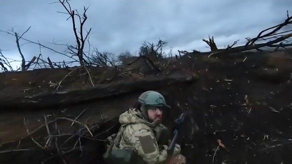 In this photo taken from video and released by the Russian Defense Ministry Press Service on Thursday, April 4, 2024, A Russian soldier at an undisclosed location in Ukraine. (Russian Defense Ministry ...
