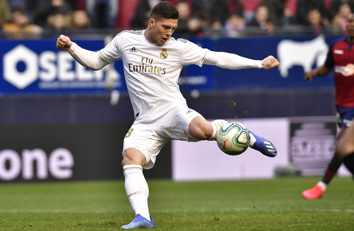 Real Madrid's Luka Jovic kicks the ball to score during the Spanish La Liga soccer match between Osasuna and Real Madrid at El Sadar stadium in Pamplona, northern Spain, Sunday, Feb. 9, 2020. (AP ...