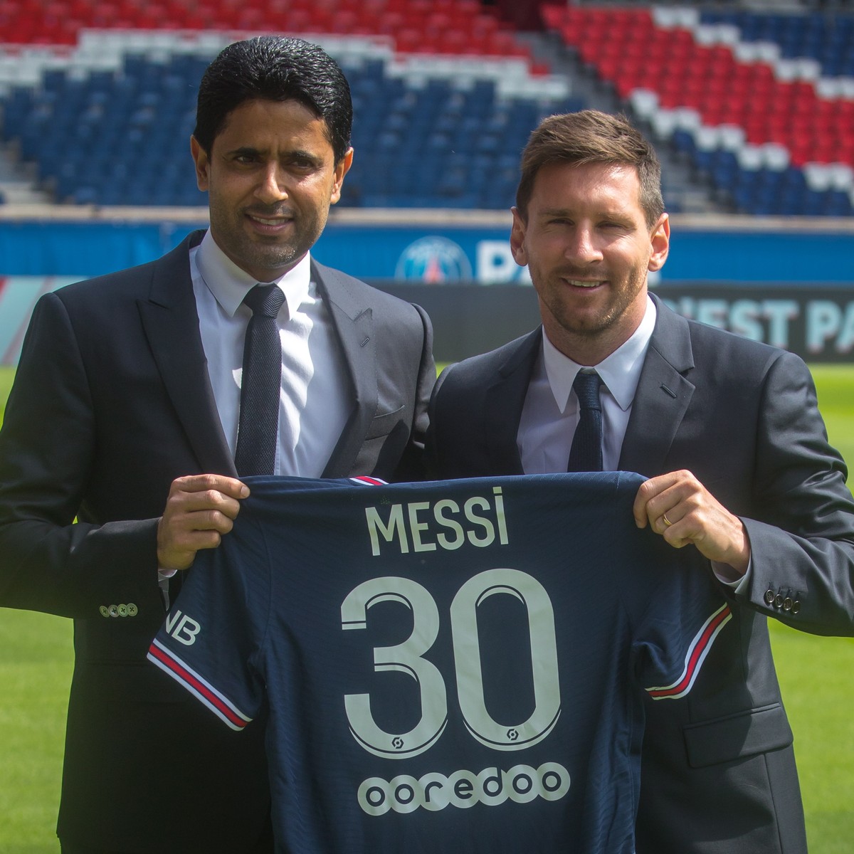 epa09409578 Paris Saint-Germain's president Nasser Al-Khelaifi (L) and Argentinian striker Lionel Messi pose with his new PSG jersey after his press conference as part of his official presentatio ...