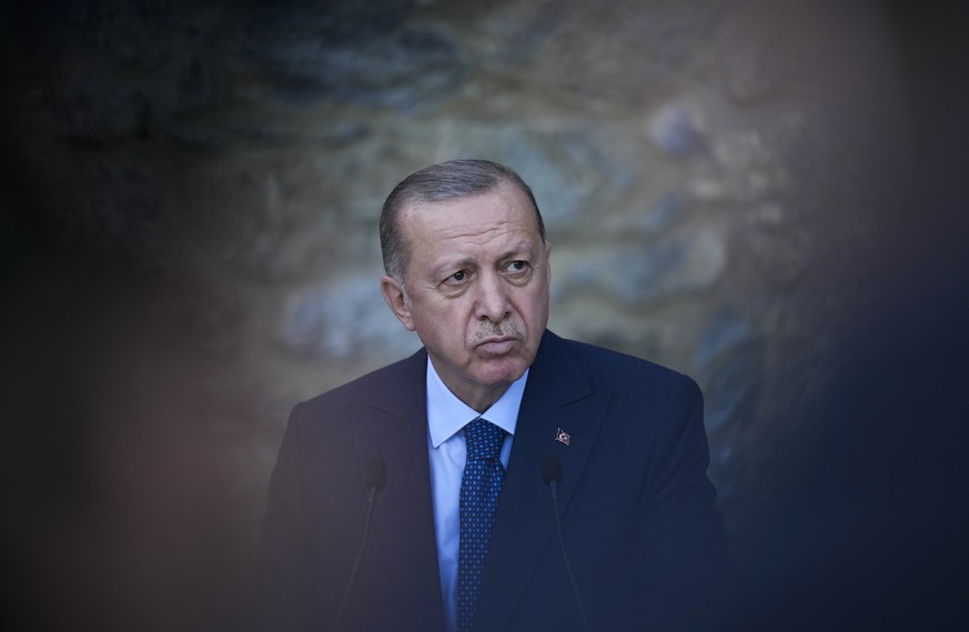 Turkey&#039;s President Recep Tayyip Erdogan listens to a question during a joint news conference with German Chancellor Angela Merkel following their meeting at Huber Villa presidential palace, in Is ...