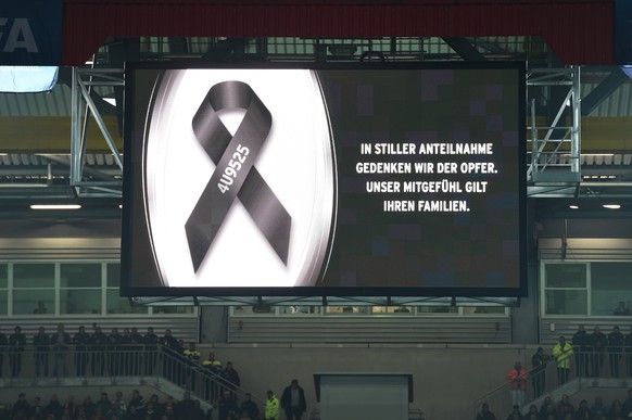 KAISERSLAUTERN, GERMANY - MARCH 25: The opposing teams observe a minutes silence in remembrance of the victims of Germanwings flight 4U9525 prior to kickoff during the International Friendly match bet ...