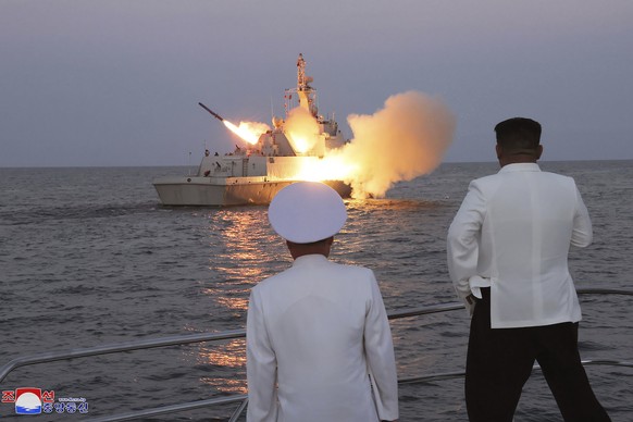 In this undated photo provided on Monday, Aug. 21, 2023, by the North Korean government, North Korean leader Kim Jong Un, right, observes what it says the test-firing of strategic cruise missiles. Ind ...