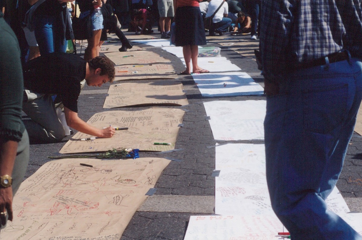 People in Union Square sign posters and cards on 9/11 in NYC xkwx 9/11, airline, airplane, attack, building, crash, danger, destruction, explosion, fire, fireball, hijacking, history, hit, impact, low ...