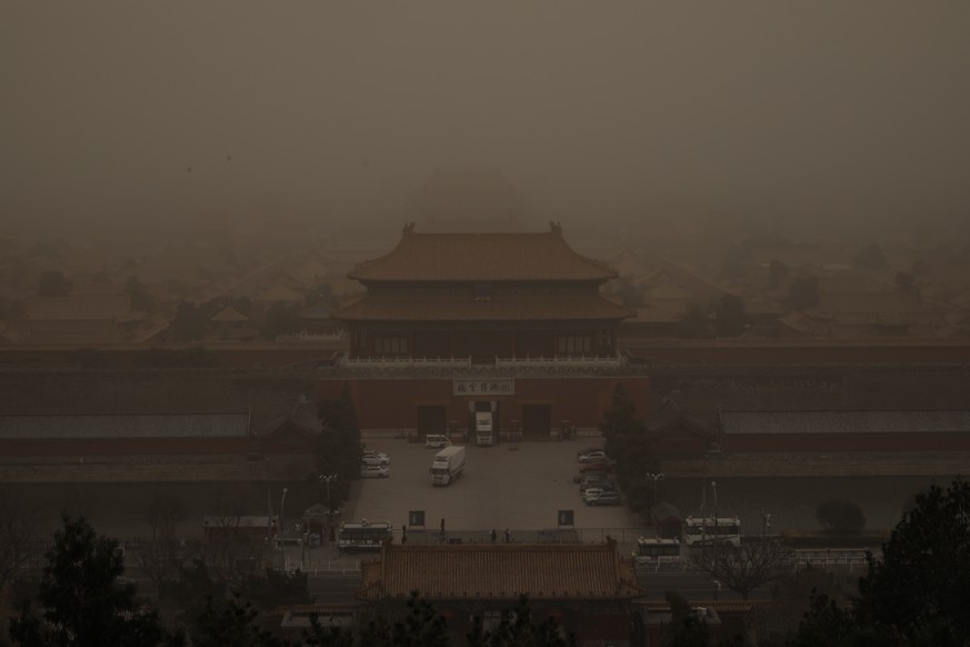 epa09075486 A view shows the Forbidden City as the area is affected by a sandstorm, in Beijing, China, 15 March 2021. According to the National Meteorological Center, floating sand and dust are expect ...