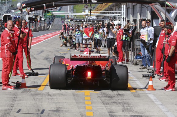 Ferrari driver Sebastian Vettel of Germany stops in the pit lane during the first practice session for the Austrian Formula One Grand Prix at the Red Bull Ring in Spielberg, Austria, Friday, July 7, 2 ...