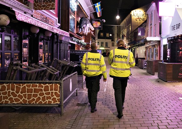epa08683722 Police patrol the amusement street Jomfru Ane Gade after 22.00 o&#039;clock in Aalborg, Denmark, 19 September 2020 (issued 20 September 2020). The government&#039;s new restrictions have c ...