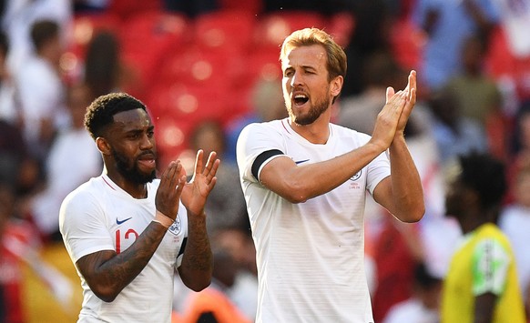 epa06781037 England players Harry Kane (R) and Danny Rose (L) applaud supporters after the International Friendly soccer match between England and Nigeria at Wembley in London, Britain, 02 June 2018.  ...