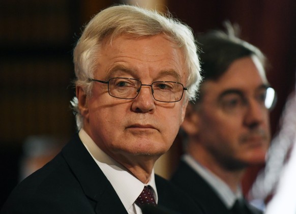 epa07043060 British MP and former Brexit Minister David Davis (L) and Conservative MP Jacob Rees-Mogg (R) attend a briefing by the Institute of Economic Affairs (IEA) think tank in London, Britain, 24 ...