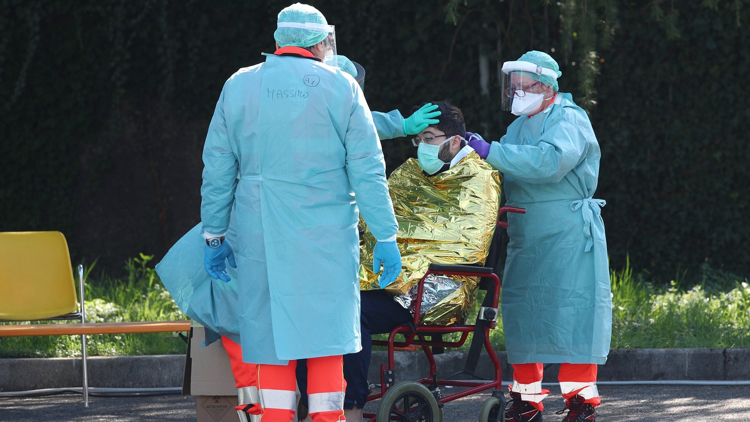 epa08298711 Doctors at work at the health check point at the Emergency Department of the Spedali Civili, in Brescia, Italy, 16 March 2020. Italy is under lockdown in an attempt to prevent the spread o ...