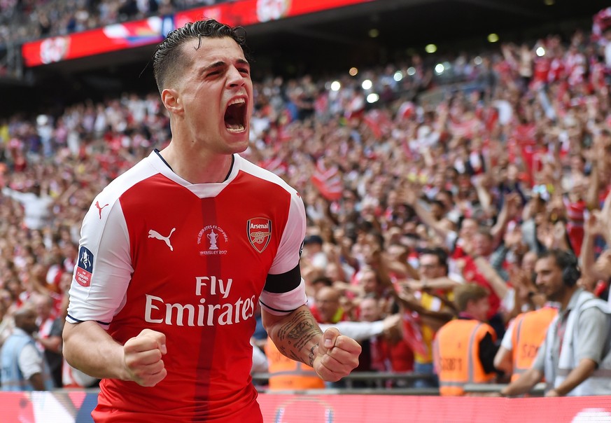 epa05994292 Arsenal Granit Xhaka celebrates after Aaron Ramsey scored against Chelsea during the FA Cup final match Arsenal vs Chelsea at Wembley Stadium in London, Britain, 27 May 2017. EPA/ANDY RAIN ...