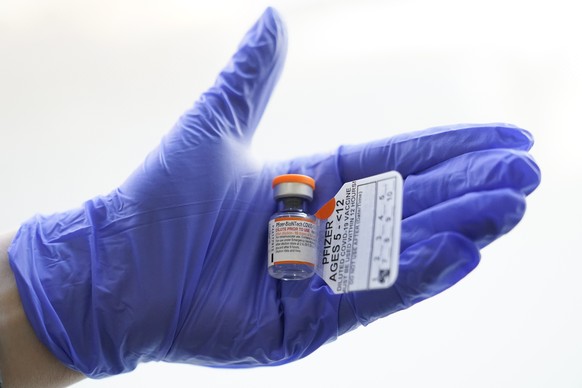 An RN holds a vial with the Pfizer-BioNTech COVID-19 vaccine for children five to 12 years at The Children&#039;s Hospital at Montefiore, Wednesday, Nov. 3, 2021, in the Bronx borough of New York. The ...