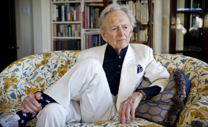 CORRECTS AGE TO 88 - FILE - In this July 26, 2016 file photo, American author and journalist Tom Wolfe, Jr. appears in his living room during an interview about his latest book, &quot;The Kingdom of S ...