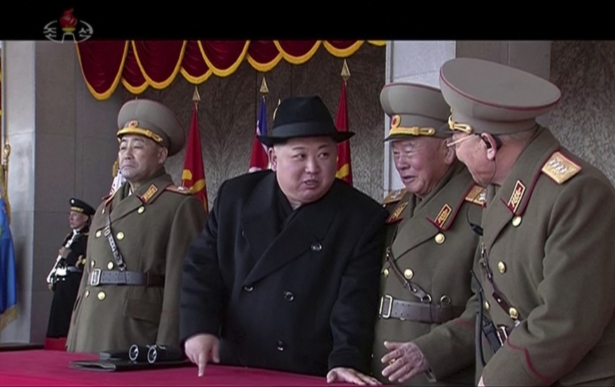 In this image made from video by North Korea&#039;s KRT, North Korean leader Kim Jong Un, center, speaks with military officials during a military parade in Pyongyang, North Korea Thursday, Feb. 8, 20 ...