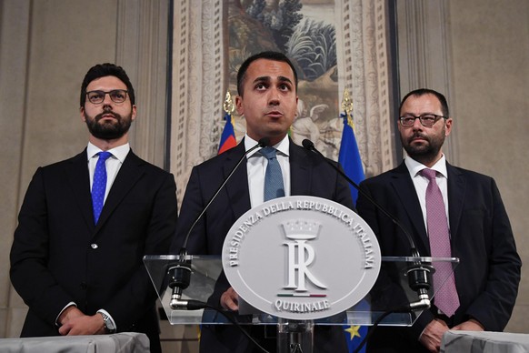 epa07799788 Movimento 5 Stelle leader Luigi Di Maio (C) with party colleagues Stefano Patuanelli (R) and Francesco D&#039;Uva (L) address the media after a meeting with Italian President Mattarella fo ...