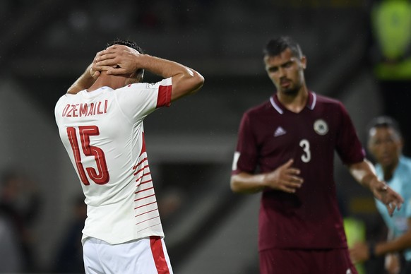 Swiss midfielder Blerim Dzemaili, left, reacts after missing a penalty shoot during the 2018 Fifa World Cup group B qualifying soccer match Latvia against Switzerland at Skonto Stadium, in Riga, Latvi ...