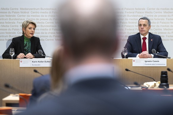 Federal President Ignazio Cassis (right) and Federal Councilor Karin Keller Sutter speak at a media conference on the division of departments in the Federal Council, on Thursday, December 8, 2022, in Bern.  ...