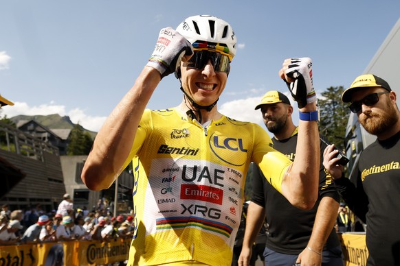 epa13110810 Yellow Jersey overall leader Slovenian cyclist Tadej Pogacar of UAE Team Emirates XRG celebrates in the finish area after winning Stage 10 of the Tour de France, a 166.6 km route from Auri ...