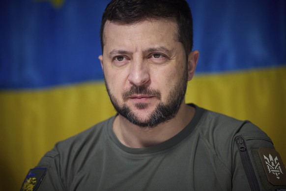 FILE - In this photo provided by the Ukrainian Presidential Press Office on July 8, 2022, Ukrainian President Volodymyr Zelenskyy, attends a meeting with military officials during his visit the war-hi ...