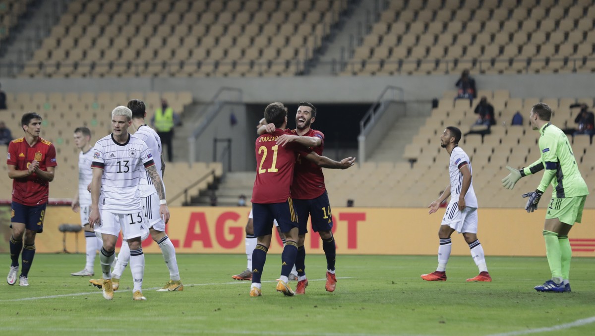 Spain's Mikel Oyarzabal, left, celebrates his goal against Germany with teammate Jose Luis Gaya, right, during the UEFA Nations League soccer match between Spain and Germany in Seville, Spain, Tu ...