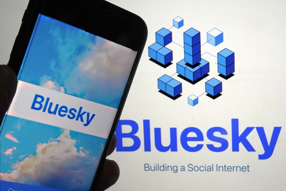 FILE - The app for Bluesky is shown on a mobile phone, left, and on a laptop screen, Friday, June 2, 2023, in New York. Bluesky, a Twitter-like social network championed by Twitter co-founder Jack Dor ...