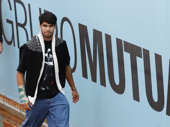 epa12924426 Spanish tennis player Carlos Alcaraz after attending the U-16 match of his brother Jaime Alcaraz against Pol Mas at the Madrid Open tennis tournament in Madrid, Spain, 30 April 2026. EPA/C ...