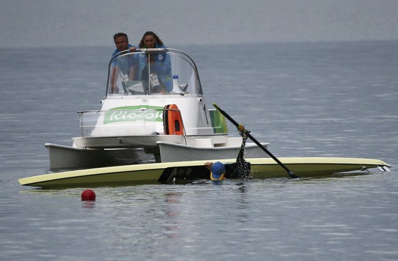 2016 Rio Olympics - Rowing - Repechage - Men&#039;s Single Sculls Repechages - Lagoa Stadium - Rio De Janeiro, Brazil - 08/08/2016. Vladislav Yakovlev (KAZ) of Kazakhstan after capsizing. REUTERS/Carl ...