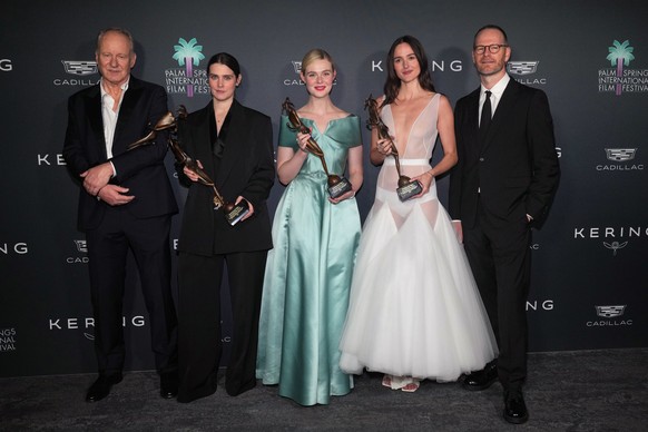 Joachim Trier, far right, and Stellan SkarsgÂrd, from left, Inga Ibsdotter Lilleaas, Elle Fanning, and Renate Reinsve pose with the international star award for "Sentimental Value" in the pr ...