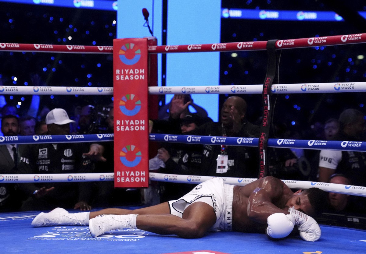 Anthony Joshua lies knocked out in the IBF World Heavyweight bout against Daniel Dubois at Wembley Stadium, in London, Saturday, Sept. 21, 2024. (Bradley Collyer/PA via AP)
Anthony Joshua
