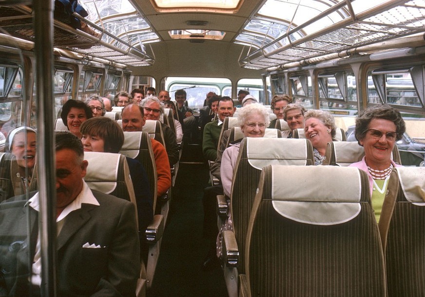 ENGLAND - MARCH 10: The passengers have arrived here for a day trip from London, and are taking a bus on an excursion. At this time the railways and bus services were facing increased competition from ...