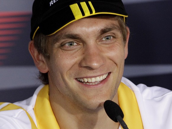 Renault Formula One driver Vitaly Petrov of Russia smiles during a drivers press conference at the Australian Formula One Grand Prix in Melbourne,Thursday, March 25, 2010. (AP Photo/Rob Griffith)