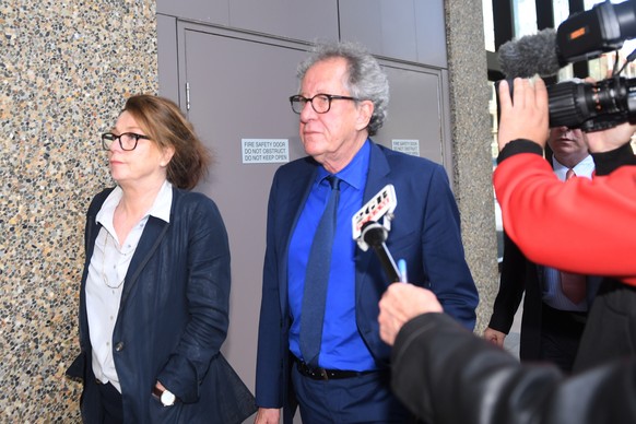 Australian actor Geoffrey Rush, center, leaves the Federal Court in Sydney, Australia Monday, Oct. 22, 2018. The actor faced a large media pack Monday as he entered Sydney&#039;s Federal Court, where  ...