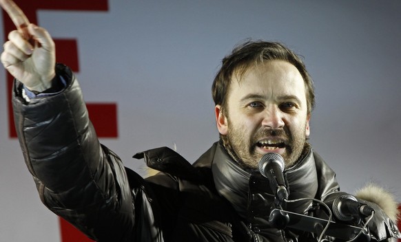 State Duma lawmaker and opposition activist Ilya Ponomaryov speaks during an opposition rally in Moscow, Russia, Monday, March 5, 2012. Riot police on Monday broke up an opposition protest contesting  ...