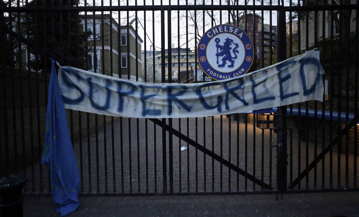 A banner hangs from one of the gates of Stamford Bridge stadium in London where Chelsea fans were protesting against Chelsea's decision to be included amongst the clubs attempting to form a new E ...