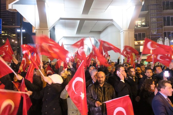 Crowd gather to welcome the Turkish Family Minister Fatma Betul Sayan Kaya, who decided to travel to Rotterdam by land after Turkish Foreign Minister Mevlut Cavusoglu's flight was barred from landing  ...