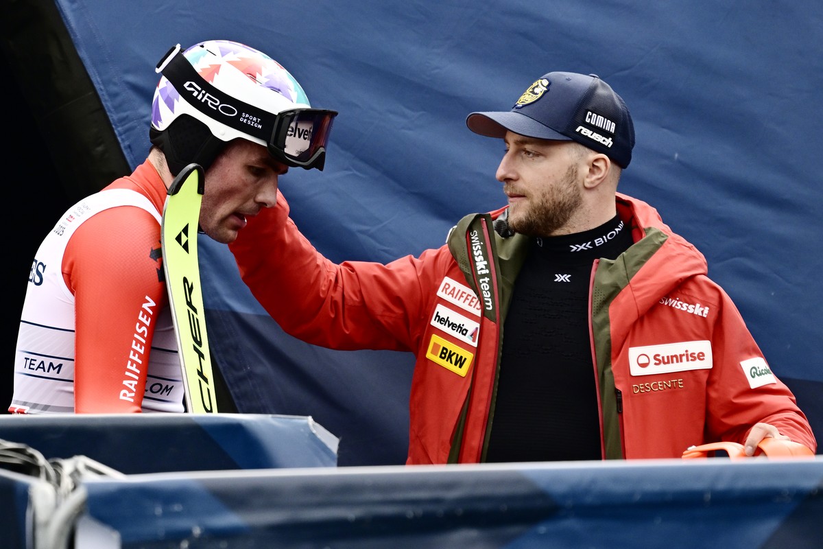 Daniel Yule of Switzerland, left, and Justin Murisier of Switzerland, right, react in the finish area during the Slalom race of the men's Team Combined at the 2025 FIS Alpine World Ski Championsh ...