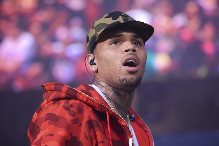 FILE - In this June 7, 2015 file photo, rapper Chris Brown performs at the 2015 Hot 97 Summer Jam at MetLife Stadium in East Rutherford, N.J. U.S. singer Chris Brown and two other people are in custod ...