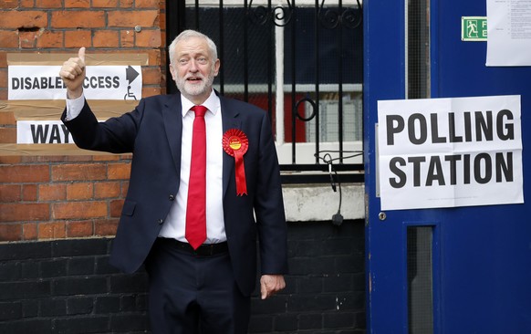 Britain&#039;s Labour party leader Jeremy Corbyn gestures as he arrives to vote in the general election at a polling station in London, Thursday, June 8, 2017. (AP Photo/Frank Augstein)